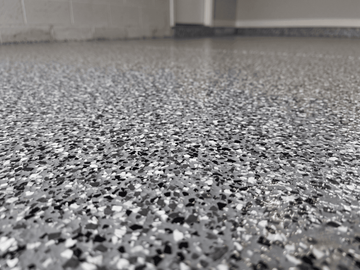 Epoxy flake floor finish close-up in a workshop space