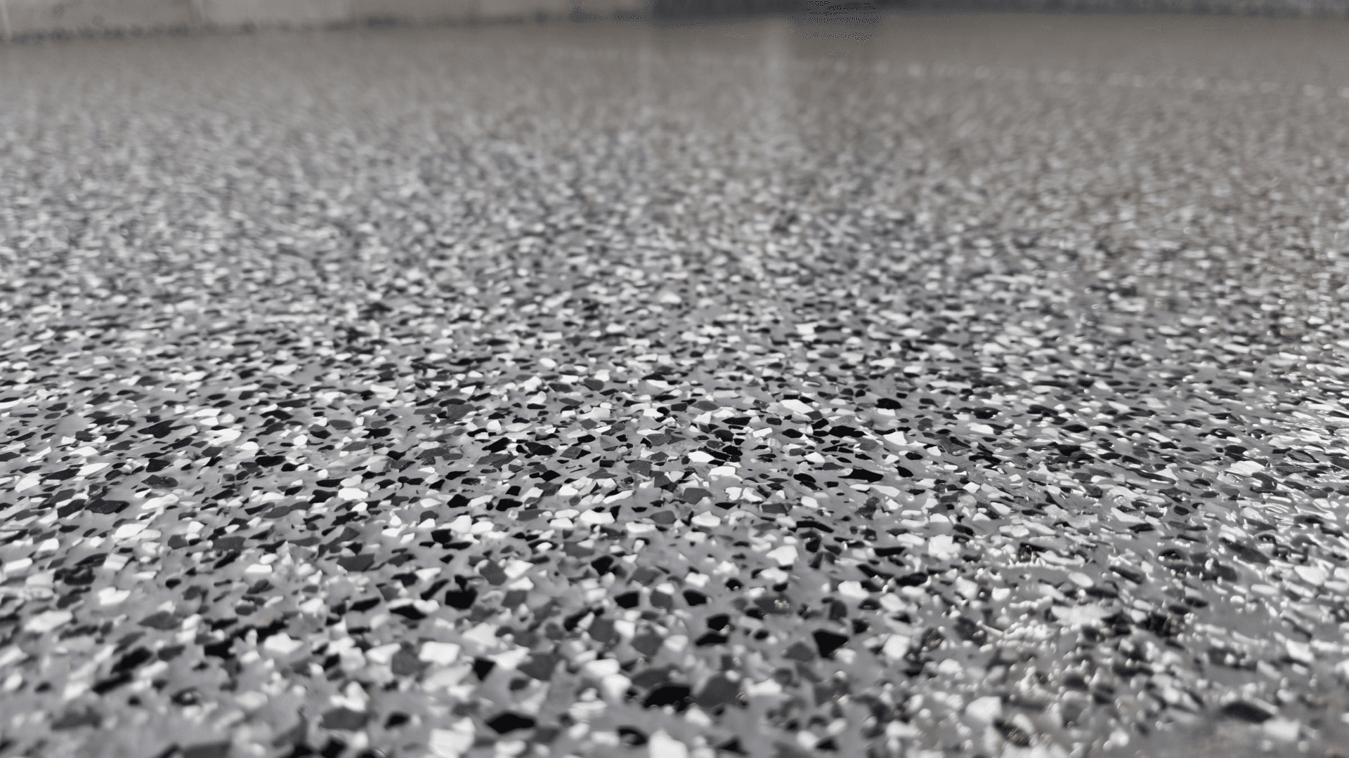Epoxy floor coating close-up on a high-use concrete floor