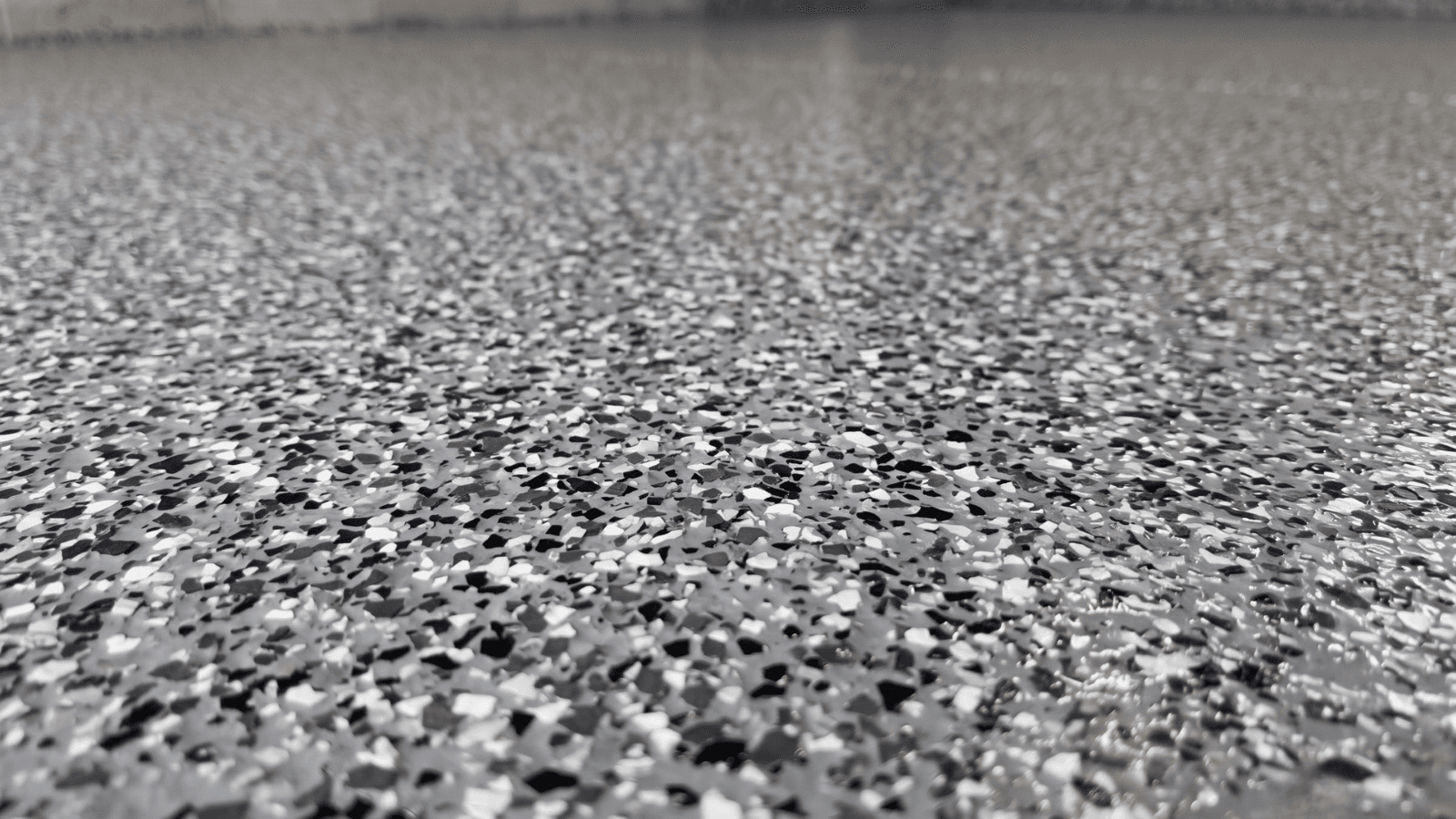 Epoxy flake floor in a residential carport or covered garage